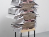 Eleven Instruments, Eleven Variations, Book Concerto in One Act: for 212 Penguins, 2018, custom table-bookshelf in ash and steel, 8 books, 204 cardboard pages of black and white photocopies (Robert Smithson: The Collected Writings by Robert Smithson), 45 x 33 x 25 cm (table removable). Performance presented in 2017 at the London Contemporary Music Festival, Ambika P3, London, UK, unique piece + 1 AP. Photo © Aurélien Mole