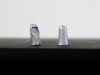 Earplugs, 2015, aluminum, table, plaster, variable dimensions