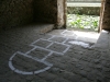 The Sky Can Wait, 2023, ephemeral in-situ installation protocol, hopscotch game, white acrylic painting, variable dimensions, edition of 3 + 1 AP