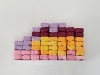 Nova Dual Lima.1, 2021 - 2024, 54 coloured wrapping tissue bricks, 27 x 14 x 5 cm, unique piece. Photography of the performance Nova Dual Lima.1, 51,5 x 91,5 cm, edition of 5 + 2 AP. Film by Alan Poma, colour, mute, 04’56’’, edition of 5 + 2 AP, 2024. Performance Nova Dual , Wu Gallery, Forecourt of Centre Pompidou, Paris, France, 4 persons, 2021. Performance Nova Dual Lima.1  in Redondo beach in Lima, Peru, 2024