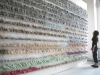 2D 1/2, 2010, Paris, France. 16 étagères, 4200 sacs en plastique, lampe, chaise, table, cadre, livre, 2 coussins, matelas, miroir, tapis, 400 x 300 x 10 cm. photographie, 13 x 7 cm, pièces uniques. Photo © Aurélien Mole