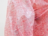 Skin, 2014, red stamp used in the slaughterhouse on disposable rain coat, variable dimensions