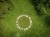 Rien à ajouter, 2019, white concrete text, 10 m diameter, unique pieces. International Hortillonnages Amiens for the Festival Art et Jardins Hauts de France, France. Photo © Yann Monel