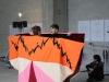 Système-berceuse, 2023, performance pour 2 ostéopathes et 2 vocalistes, durée variable. Performeurs : Alixe Llamas, Soledad Cavalier, Cathy Gringelli, Violaine Lochu. Partition costume, wax et velours, 2 m 50 x 1 m 50, pièces uniques. Production Bétonsalon, Paris, France