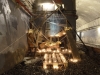 Radeau échoué, 2015, installation secrète réalisée dans le métro parisien sans autorisation, bois, laine, bougies, couvertures de survie, dimensions variables